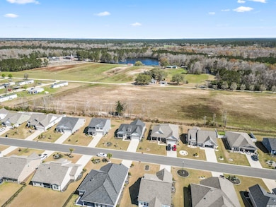 Bird's eye view with a water view and a residential view