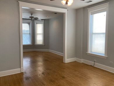 Living room and dining room offer flexible living/