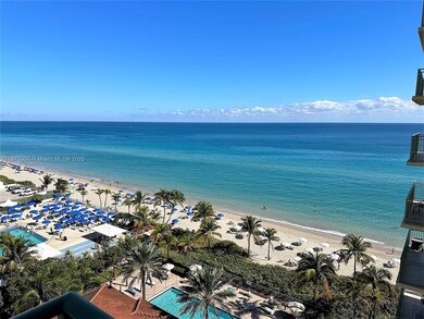 Wide view overlooking the pool and beach