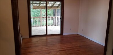 Living room with hardwood flooring...