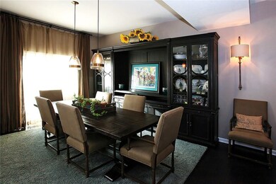 Beautiful pendant lighting adorns this dining spac