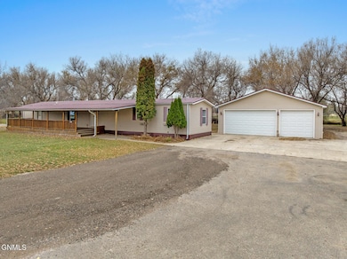 3207 9th Ave E, Williston, ND 58801 - photo 2