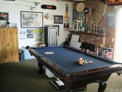 game room, den with fireplace. Access to sun room/