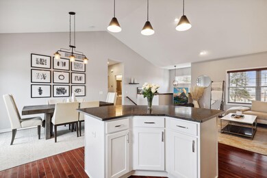 Open floor plan with dramatic vaulted ceilings