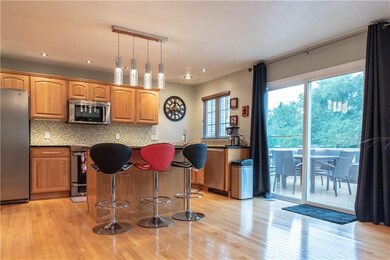Open kitchen with updated lighting, recessed light