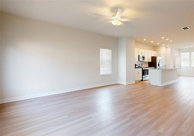 Unfurnished living room with light wood-type floor