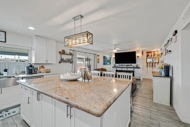 Kitchen with plenty of natural light, ceiling fan,