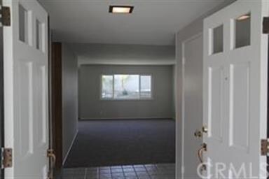 VIEW OF LIVING ROOM FROM ENTRANCE