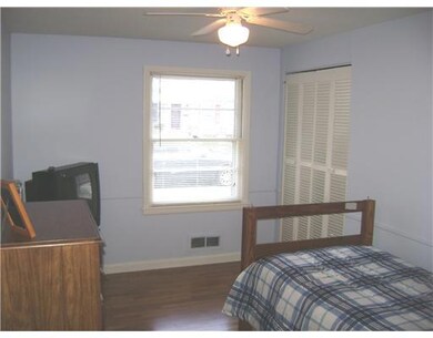 Bedroom. refinished hardwoods and new paint