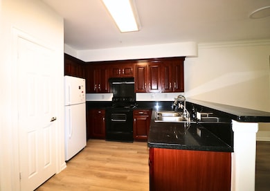 This kitchen includes refrigerator, with all appli