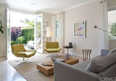 VIEW FROM LIVING ROOM TO FRONT COURTYARD