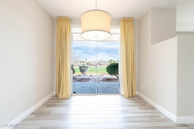 Dining area with baseboards and Porcelain Tile