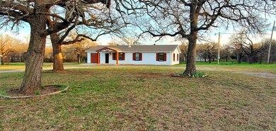 Ranch-style house featuring a front lawn
