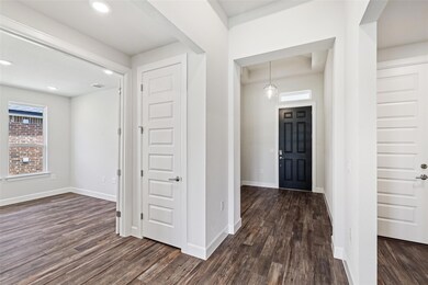 Entrance foyer featuring dark wood-type flooring 