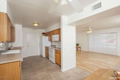 DINING AREA TO KITCHEN AND LIVING ROOM
