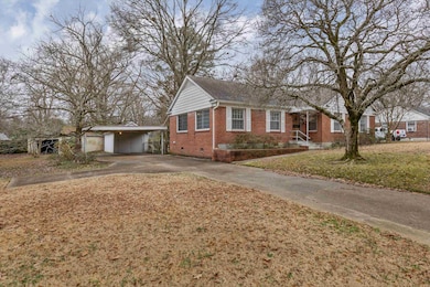 View of front of home with a carport