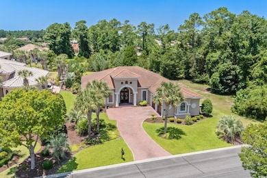 Mediterranean / spanish-style home featuring decorative driveway, a front yard, and stucco siding