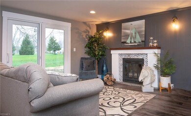 Herringbone Carrera marble surrounds a wood burnin