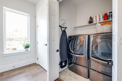Laundry area with washing machine and dryer and li