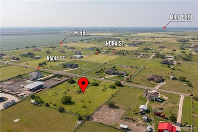 Aerial overview of property's location with rural landscape