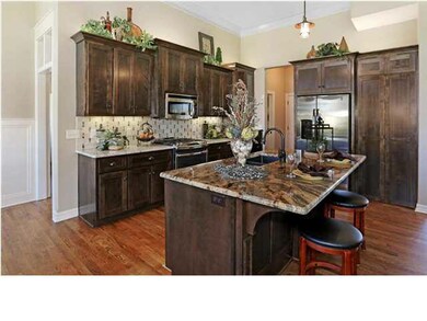 View into Great Room and Kitchen from Entry