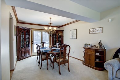 Beautiful formal dining space with tasteful crown