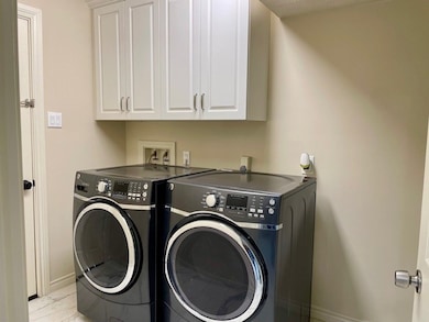 Utility room has backdoor for easy entry from carp