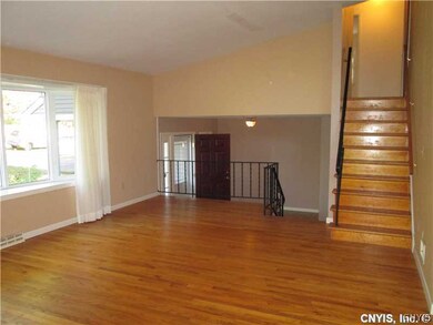 Living Room. SPACIOUS FOYER WITH HALF BATH AND LAR