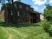 View of rear of home and wonderful private backyard.