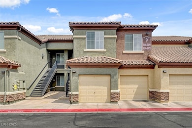 Mediterranean / spanish house featuring stucco siding, a garage, and a tile roof