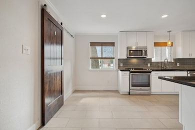 Eat-In Breakfast Area with custom barn door to the