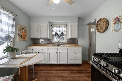 Eat in kitchen with stainless steel appliances.