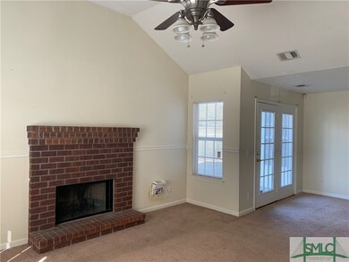 Living Room with Brick Front Fireplace