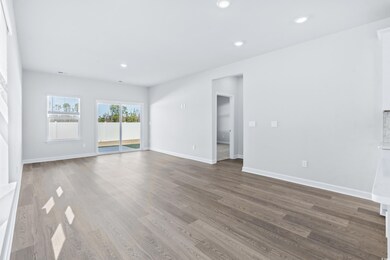 Unfurnished room featuring hardwood / wood-style f