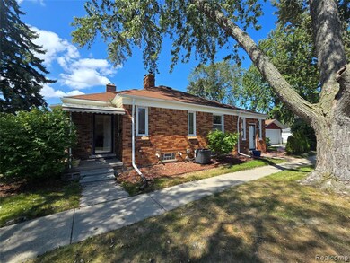 View of front of home featuring brick siding and a chimney