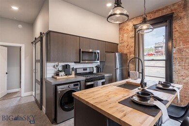 Kitchen featuring appliances with stainless steel
