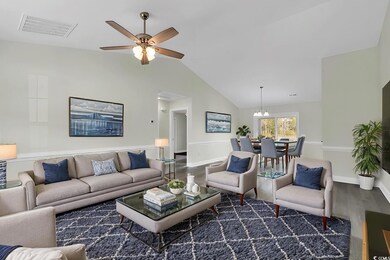 Living room featuring dark hardwood / wood-style f