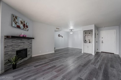 Unfurnished living room featuring a tile fireplace