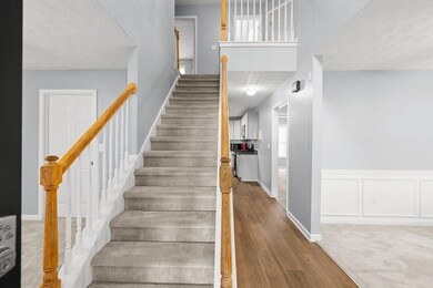 Enter to see a grand 2-story foyer with the formal living room to your right and a bonus room to your left.