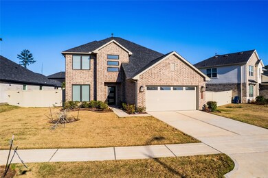 This photo shows a modern two-story brick home wit