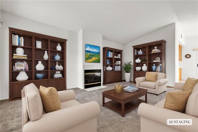 Carpeted living area featuring vaulted ceiling and