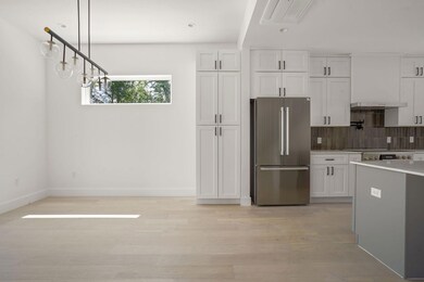 Kitchen with visible vents, freestanding refriger