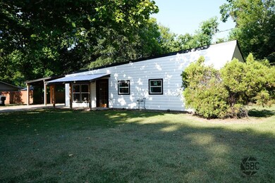 View of front facade with a carport