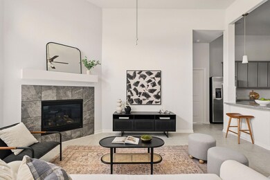 Living room featuring a ceiling fan, light tile p