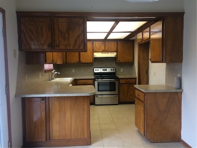 Kitchen With Newer Gas Range, Breakfast Bar, Newer