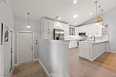 Kitchen with pendant lighting, kitchen peninsula,