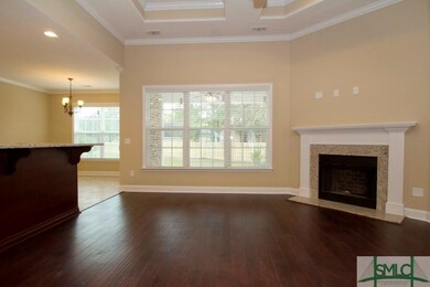 A triple Window and Gas Fireplace set the mood in 