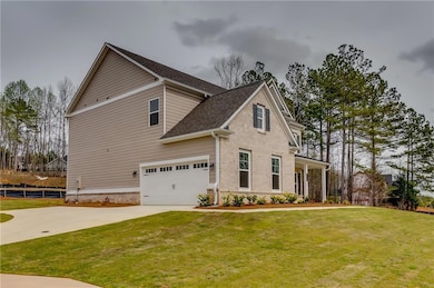 View of front of property featuring concrete drive