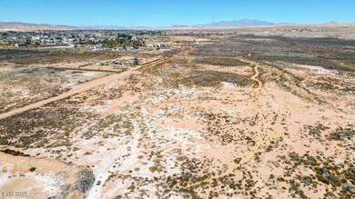 Drone / aerial view featuring a desert view and a