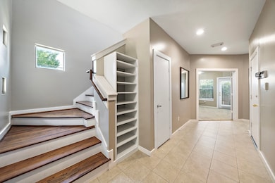 Step into a bright, welcoming entry with sleek til